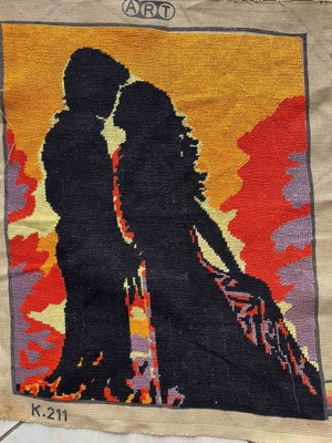 Handmade embroidery used, couple silhouette with sunset