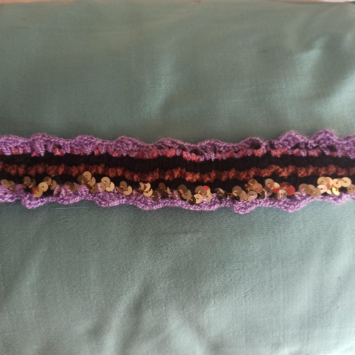 Boho knitted bracelet like new with purple and gold sequins