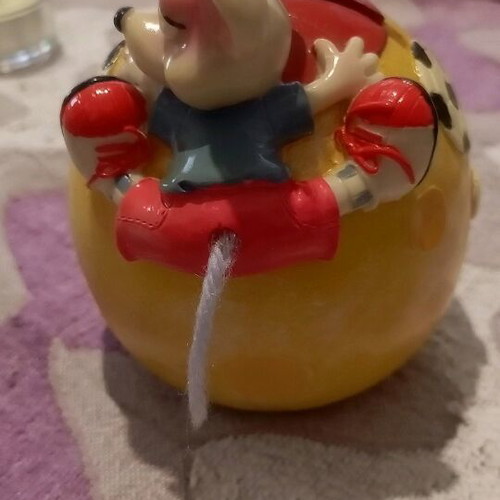 Ceramic piggy bank used with bottom opening