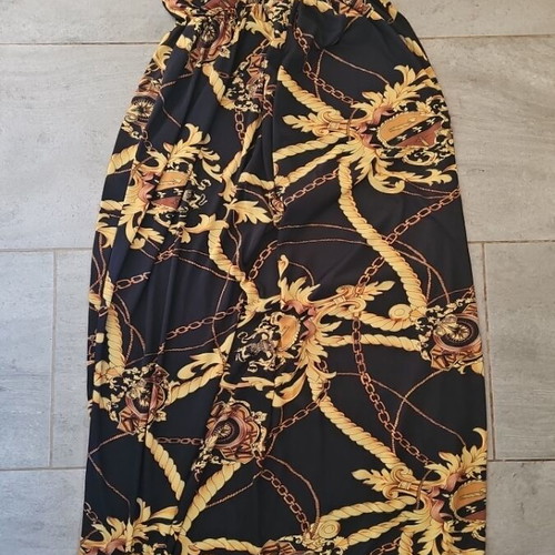 Strapless dress with gold designs used, size medium