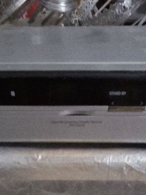 Satellite receiver used with two module slots