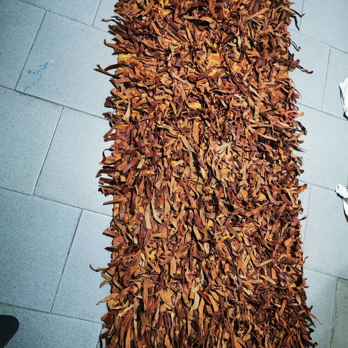 Leather flokati rug like new, brown shades, 138cm x 64cm