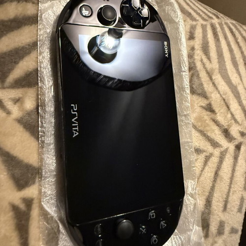 PS Vita Slim Model 2004 handheld console, brand new