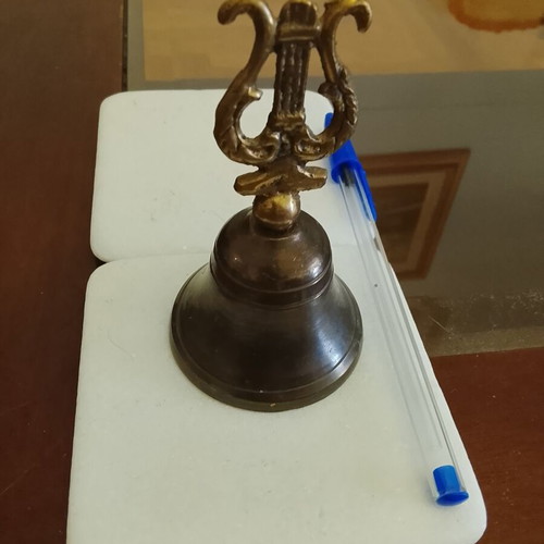 Vintage brass hand bell with ancient lyre handle, used, functional