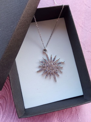 Necklace with silver sun motif, new