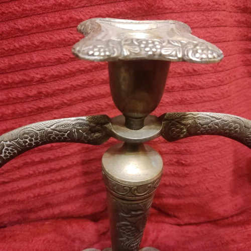 Metal triple candlestick used, ornate and heavy