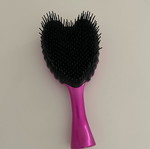 Small comb used, fuchsia color