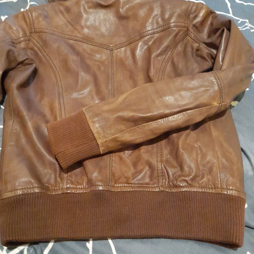 Brown leather women's jacket used with broken zipper