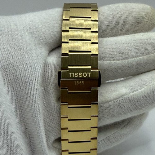 Tissot PRX Quartz watch with golden dial