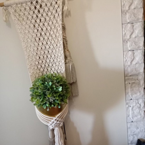 Two knitted wall hangers for pots, different sizes