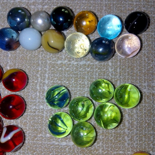 Set of 68 glass marbles used with collectible designs and 2 large shooters