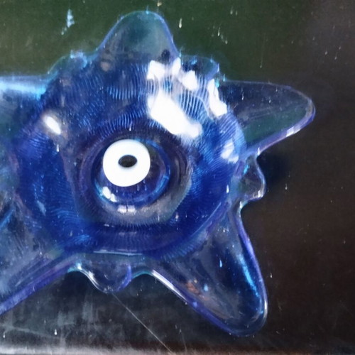 Star-shaped glass ashtray used, decorative