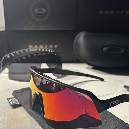 Oakley Sutro sunglasses new with two lenses black and red