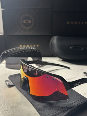 Oakley Sutro sunglasses new with two lenses black and red