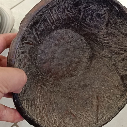 Antique wooden bowl with leather used