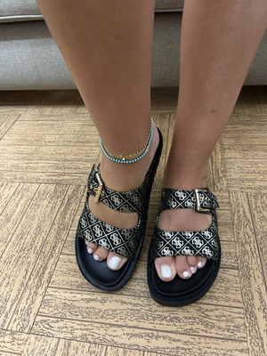 Guess black women's slippers with gold monogram design