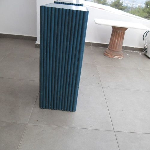 Console table used with 2 blue/navy bases and glass top