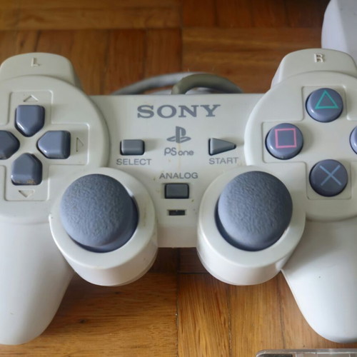 Sony PS One Slim console bundle with 2 controllers, official bag & 4 games