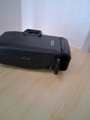 Canon camera used with battery door issue