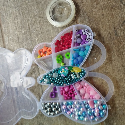 Colored beads used with thread, incomplete set