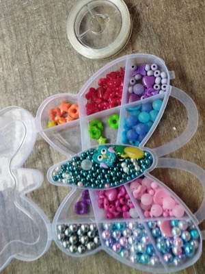 Colored beads used with thread, incomplete set