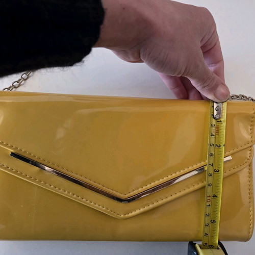 Aldo yellow vinyl clutch bag used with gold trim