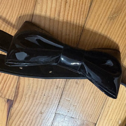Children's belt like new, black vinyl with bow 55 cm