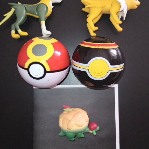 Pokémon Jolteon Boltund Appletun figures and two Poké Balls used