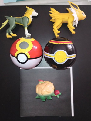 Pokémon Jolteon Boltund Appletun figures and two Poké Balls used