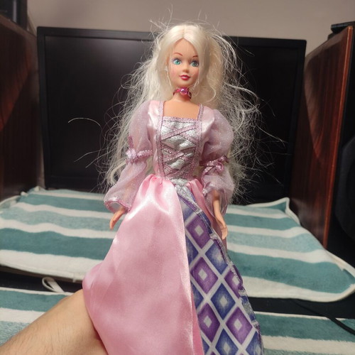 Doll with beautiful dress used