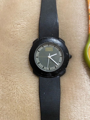 Benetton by Bulova women's watch used, black with marks and hour hand repair needed