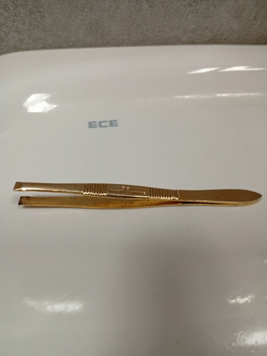 French vintage tweezers used, likely gold-plated from Nogent