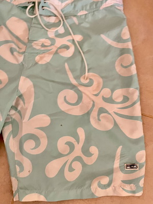 Med men's board shorts used, mint color, size L