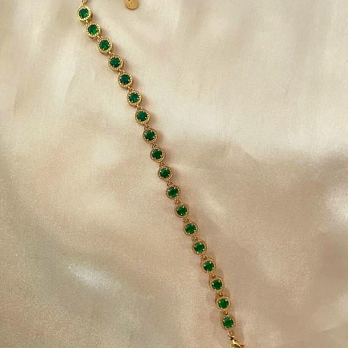 Riviera stainless steel bracelet new with green stones in gold color