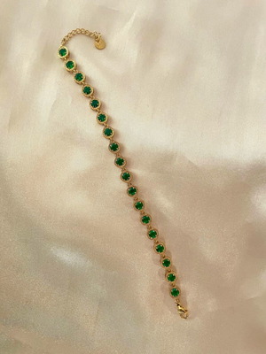 Riviera stainless steel bracelet new with green stones in gold color