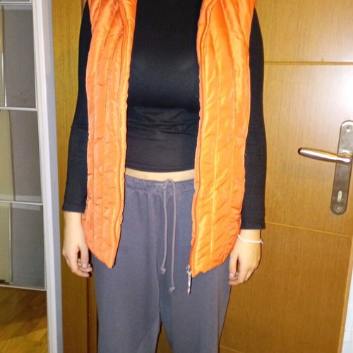 Sleeveless women's jacket like new, size large, orange