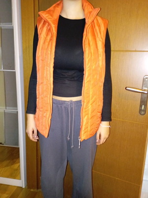 Sleeveless women's jacket like new, size large, orange