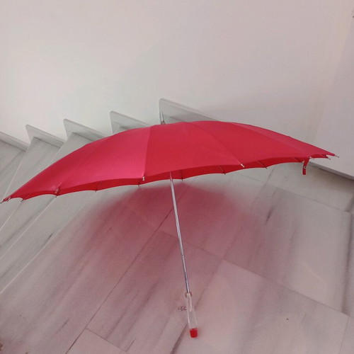 Women's red stick umbrella like new, 100% nylon