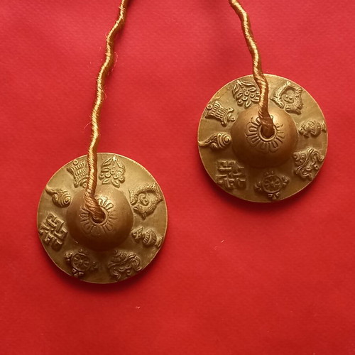 Tibetan cymbals used, known as Tingsha