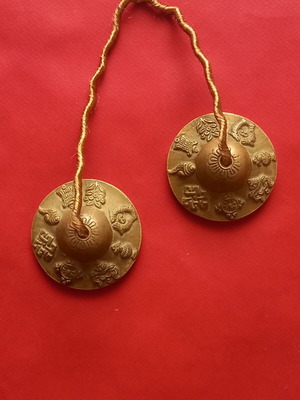 Tibetan cymbals used, known as Tingsha