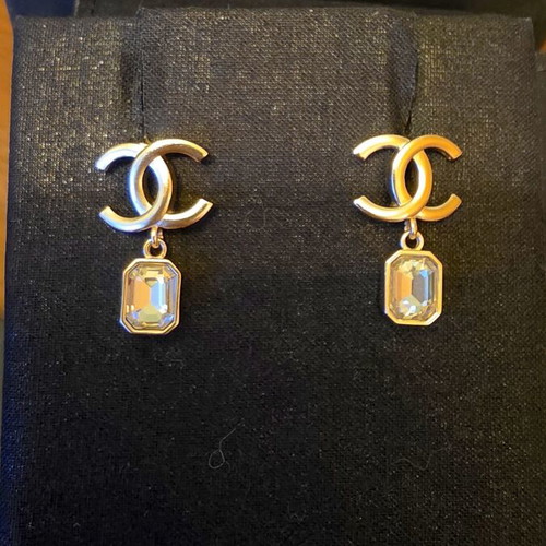 Chanel earrings with white and gold details