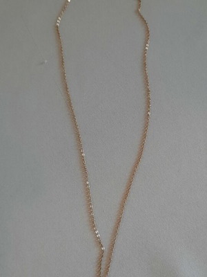 Steel necklace in rose gold with bird motif, used