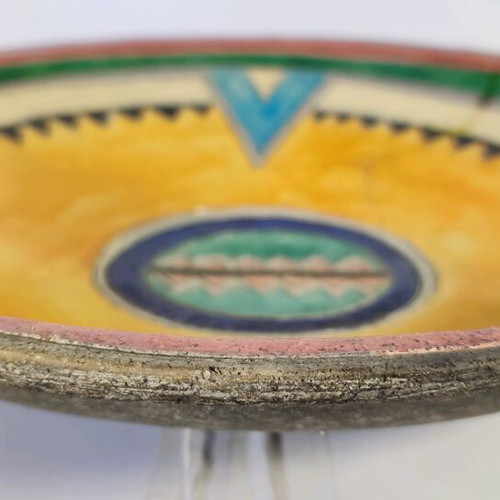 Mexican style ceramic plate and vase with plant composition used