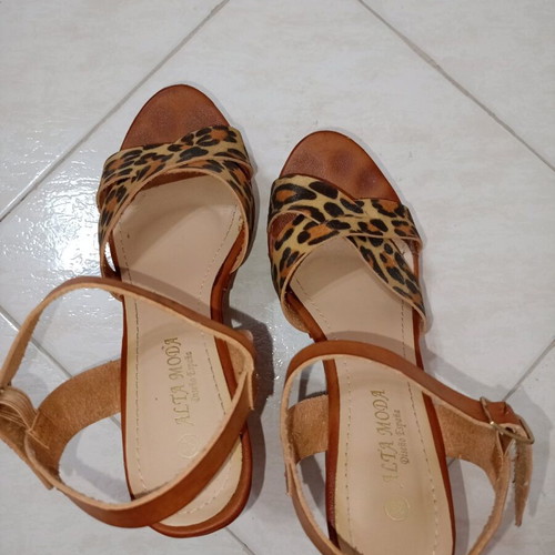 Tan platforms with animal print used, size 38