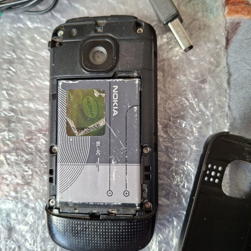Nokia C2-05 phone with charger, headphones and data cable
