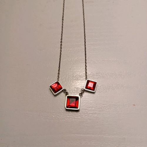 Stainless steel necklace like new with red and silver details