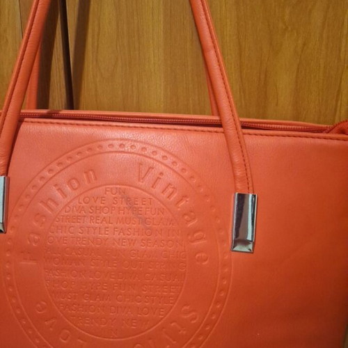Red shoulder bag used with multiple compartments and zippers
