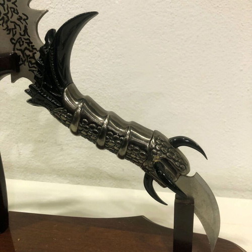 Decorative stainless steel knife with stand like new