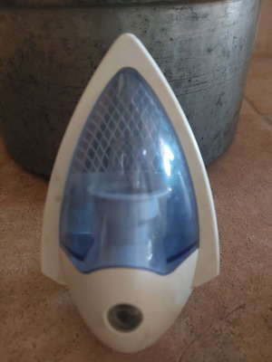 White plug-in night light like new