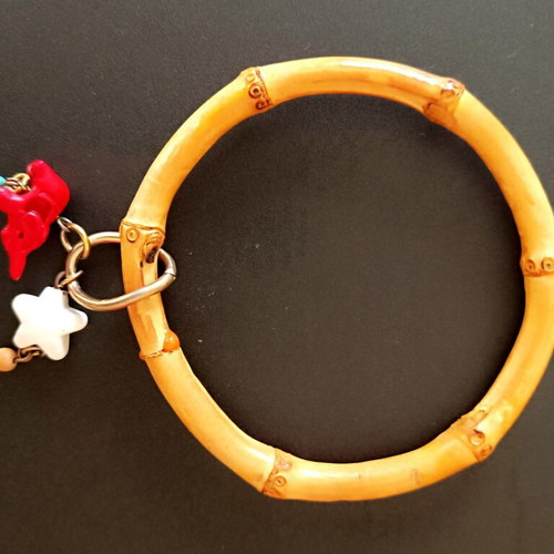 Bamboo bangle with tiki charms like new